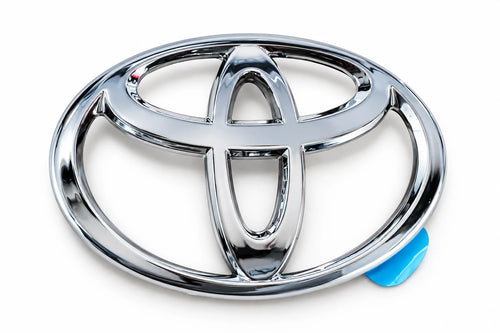 Silver chrome reproduction Toyota "T" trunk lid emblem for the SW20 MR2 with pre-applied adhesive tape